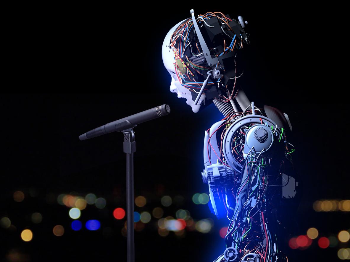 Human face cyborg speaks something into the microphone.