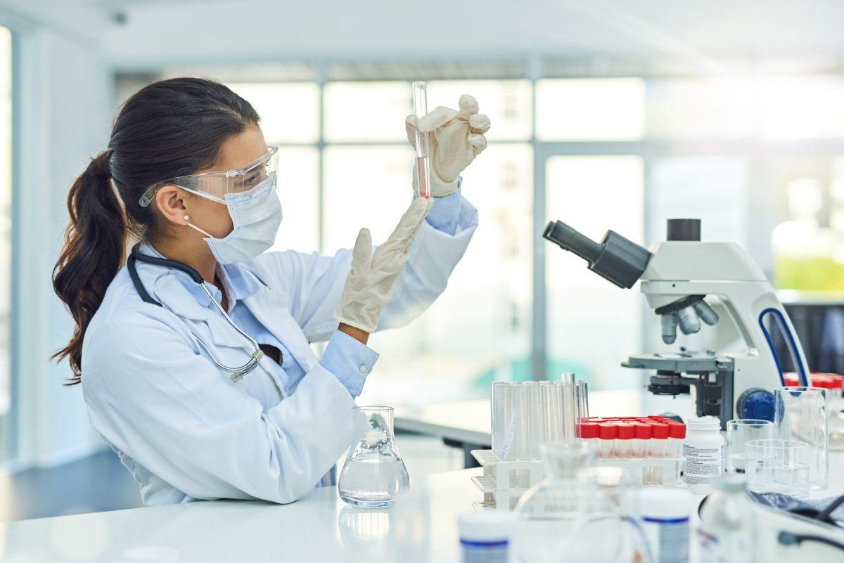 Shot of a young scientist working in a lab